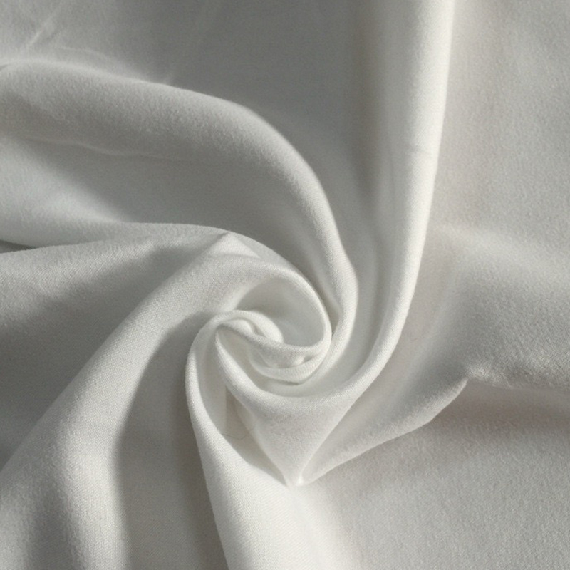 Wat is polyester perzikhuidstof precies en hoe krijgt het zijn textuur?